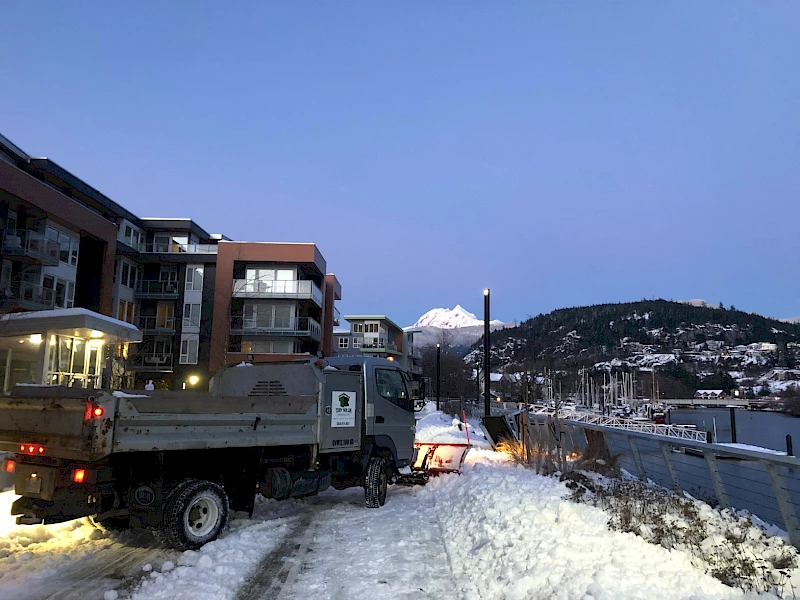Snow plow removing and clearing snow